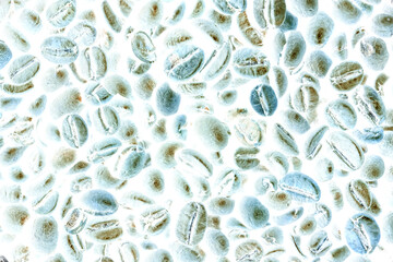 Close-up of white and blue coffee beans, color inversion. Top view, creative photography.