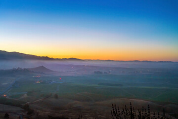 Sunrise, sunset over valley, fog, haze, foggy