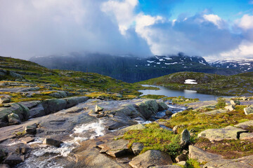 river on the snowy heights of the trolltunga