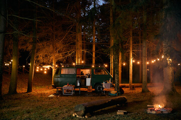Travel van at camper trailer park at night.