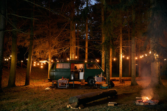 Travel van at camper trailer park at night.
