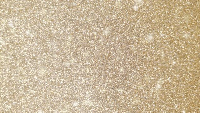 Looping animation of a sparkling golden glitter pattern background