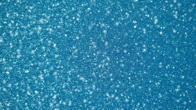 Looping animation of a shining blue glitter texture