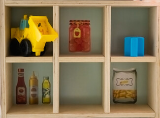 Kid's shop with wooden cells like shelf 