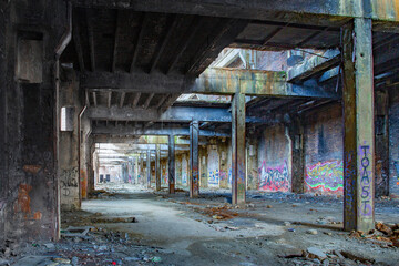 Messy abandoned factory warehouse. Creepy industrial hall