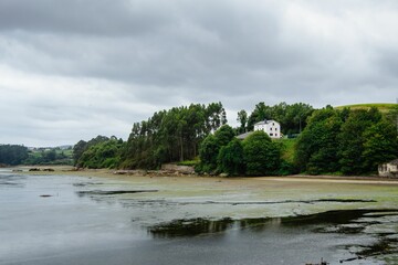 Scenic view of a lake in Asturias on a cloudy day