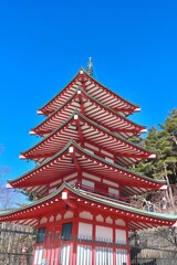 Fototapeta na wymiar an oriental pagoda sits high above the park area in japan
