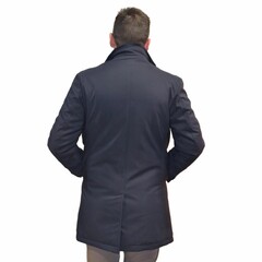 a man in a winter dark blue jacket with a vest, and trousers on a white background. Back  view