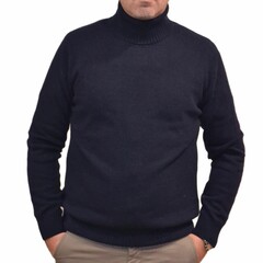 man in a dark blue high-neck wool sweater and trousers on a white background. Front  view  