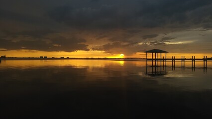 Dark sunset over the calm water
