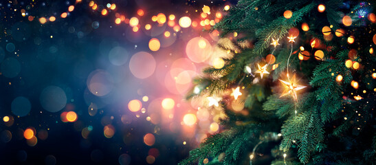 Christmas Tree With Lights In Blue - Stars Hanging On Fir Branches With Glittering And Bokeh In...