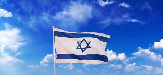 Flag of Israel in the wind against the background of the sea and with the yellow sky November 1, 2023 Tel Aviv 