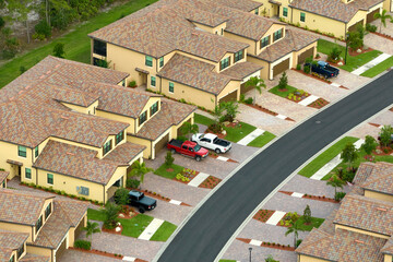 Aerial view of tightly packed homes in Florida closed living clubs. Family houses as example of...