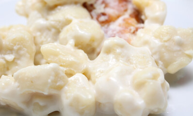 closeup on meal. gnocchi with grated cheese. meal details. gnocchi with selective focus.