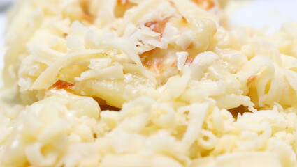 closeup on meal. gnocchi with grated cheese. meal details. gnocchi with selective focus.
