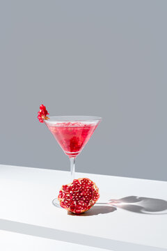 Elegant pomegranate cocktail presentation with fresh pomegranate