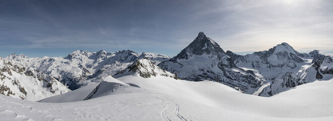 Idyllic mountain and landscape covered with snow against sky