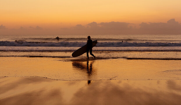 Sunset and anonymous Surfer Silhouette