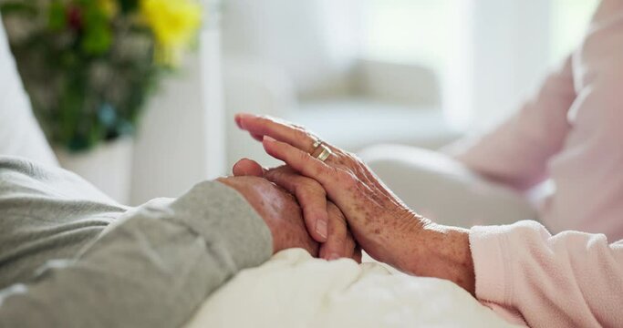 Senior, couple and holding hands for care in closeup, together and trust in marriage. Man, woman and caring for comfort, embrace and love for bonding in home with support for spouse in retirement