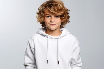 a boy in a white hoodie