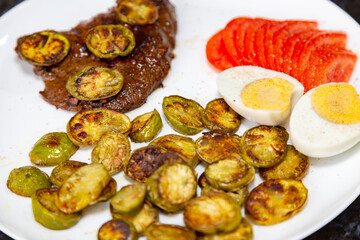 The most traditional grilled beef liver with jiló. Brazilian rustic food