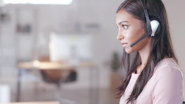 Helpdesk call centre agent promoting marketing deals and sales to clients using a headset in her agency. Assertive and confident customer service operator helping, explaining and advising customers