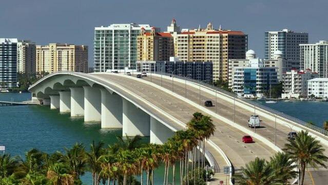Above view of Sarasota city, Florida with waterfront office high-rise buildings and John Ringling Causeway leading from downtown to St. Armands Key. Development of housing and transportation in the US