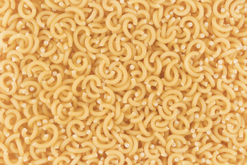 Dry pasta closeup uncooked on background