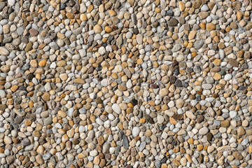 full-frame texture showcases the surface of granulite, displaying small glistening gemstones embedded in a cement pattern