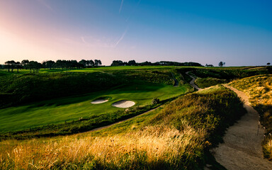 sunrise over the field and hills