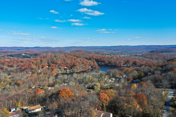 Wantage NJ and Lake Neepaulin on a sunny autumn day with fall foliage aerial 