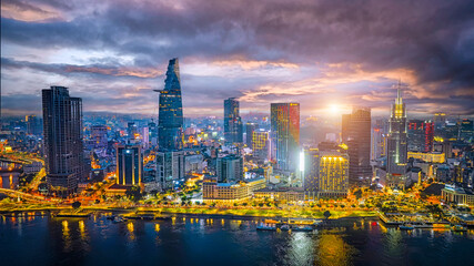 Aerial cityscape view of HoChiMinh city and the River Saigon, Vietnam with blue sky. Financial and...