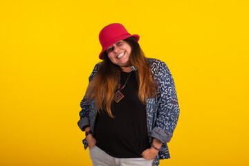 Fat woman wearing red hat in studio photo on yellow background with various facial expressions