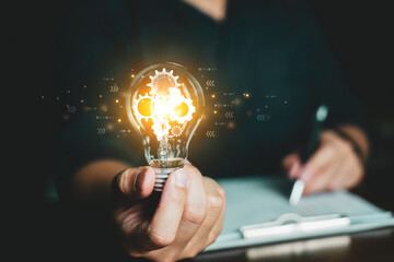 Concept Idea and innovation. Business people holding lightbulb.   - Powered by Adobe