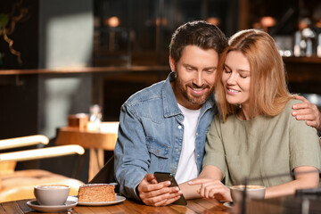 Romantic date. Lovely couple spending time together in cafe, space for text
