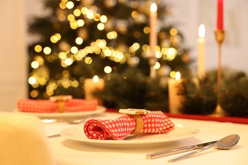 Festive table setting and beautiful Christmas decor indoors, space for text. Interior design