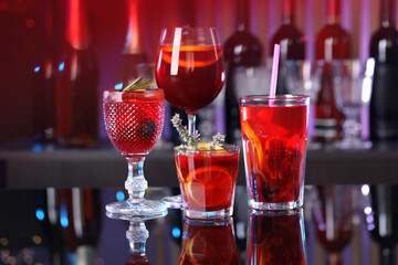 Many glasses of delicious refreshing sangria on counter in bar