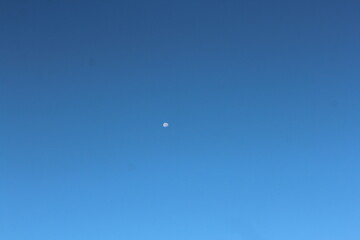moon and a clear blue sky