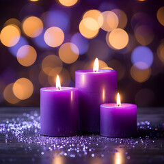 Obraz na płótnie Canvas Purple candles with bokeh lights in the background. 