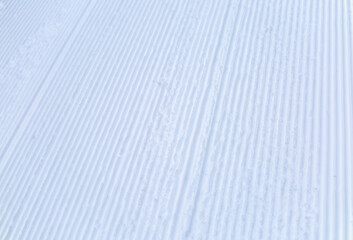 Just groomed empty ski run close-up as a background