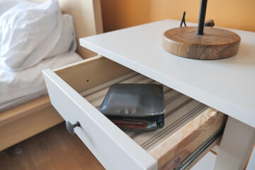 a wallet in a open drawer closeup.