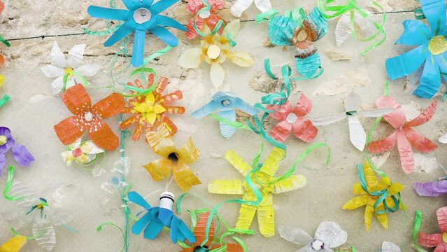 Plastic Drinking Bottles Recycled And Repurposed Into Painted Flower Decorations