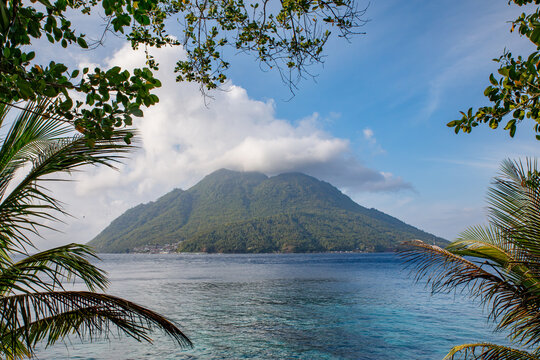 View of the volcanic Hiri island from Jikomalamo beach in the island of Ternate - both belonging to the Maluku archipelago in Indonesia