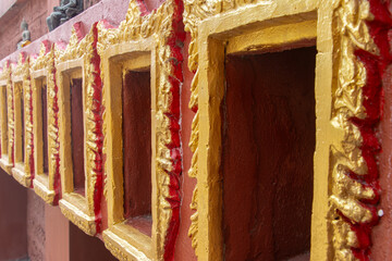 Decorative niches in the wall of a Buddhist temple intended for containers containing the ashes of...