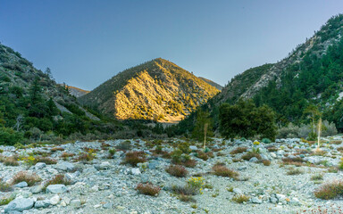 Sunlight highlights a distant peak in the San Gabriel Mountains 