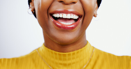 Teeth, smile and closeup of black woman with beauty, lips or happiness in studio white background....