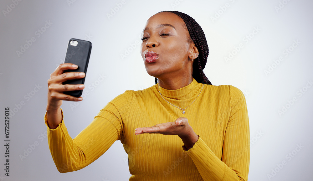 Poster Studio, kiss or black woman taking selfie on social media with confidence, post or smile online. African lady, memory or beauty influencer taking a photograph, vlog or picture on grey background