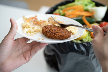 people put bio trash from food waste in domestic homes to compost bins to make fertilizer to reduce global environmental pollution.