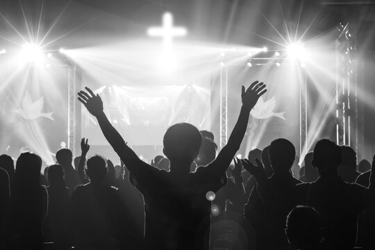Christian worship God together in Church ,raised hand and praise the lord