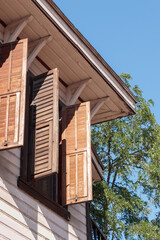 Wooden window with grille of wooden house